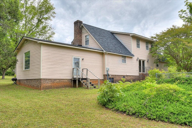 back of house with a yard