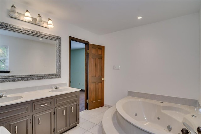 bathroom with vanity, a tub to relax in, and tile patterned floors