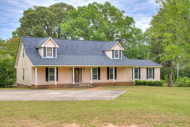 cape cod home featuring covered porch and a front yard