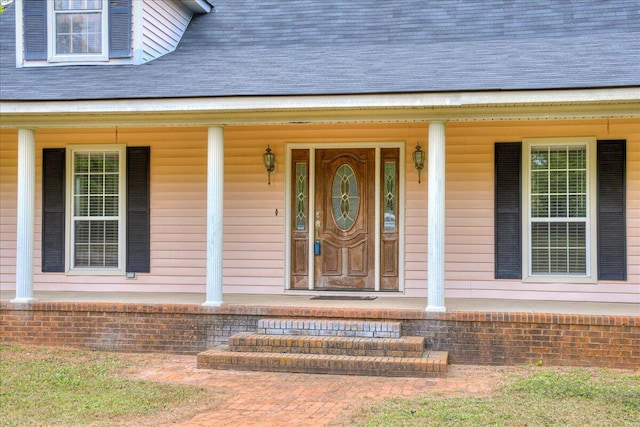 doorway to property with a porch