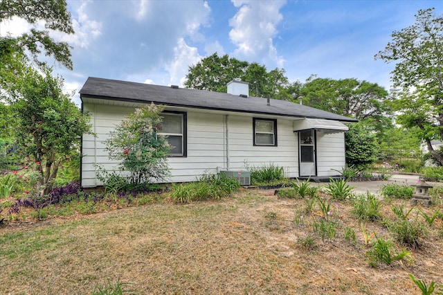 2454 Ridge Rd, Augusta, GA 30906 - back of house with central air condition unit and a chimney