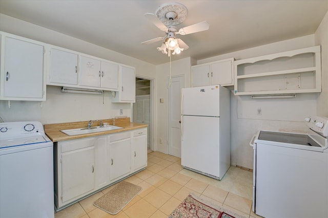 2454 Ridge Rd, Augusta, GA 30906 - kitchen with freestanding refrigerator, washer / dryer, a sink, and a ceiling fan