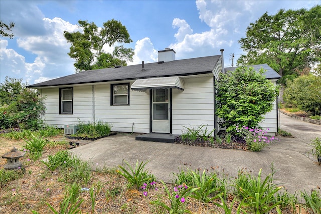 2454 Ridge Rd, Augusta, GA 30906 - rear view of house with a chimney, a patio area, and central AC unit