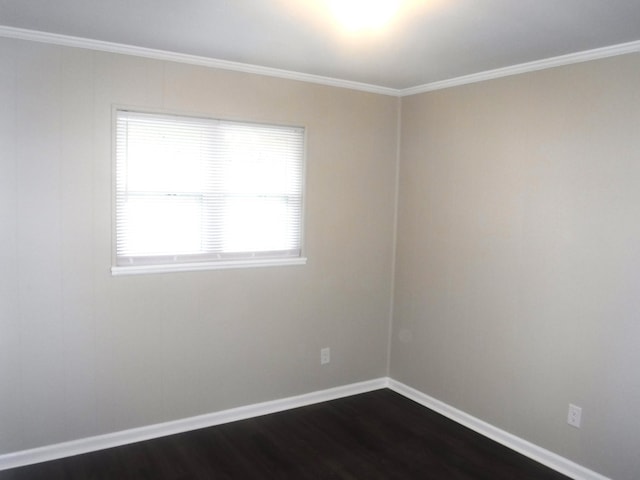 unfurnished room featuring plenty of natural light, ornamental molding, and dark wood-type flooring