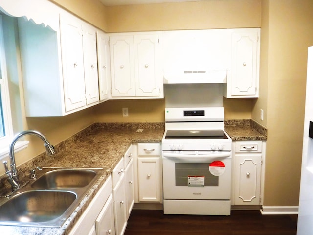 kitchen featuring sink, white range with gas stovetop, dark hardwood / wood-style floors, ventilation hood, and white cabinets