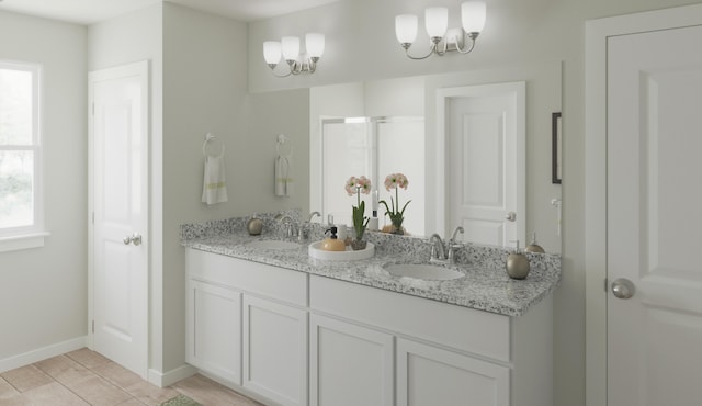 bathroom featuring double vanity, a shower stall, baseboards, and a sink