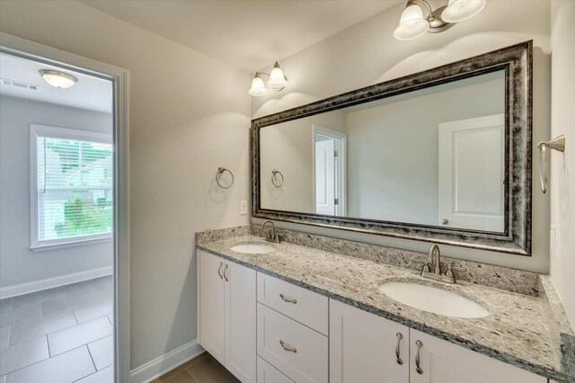 bathroom featuring tile patterned floors and vanity