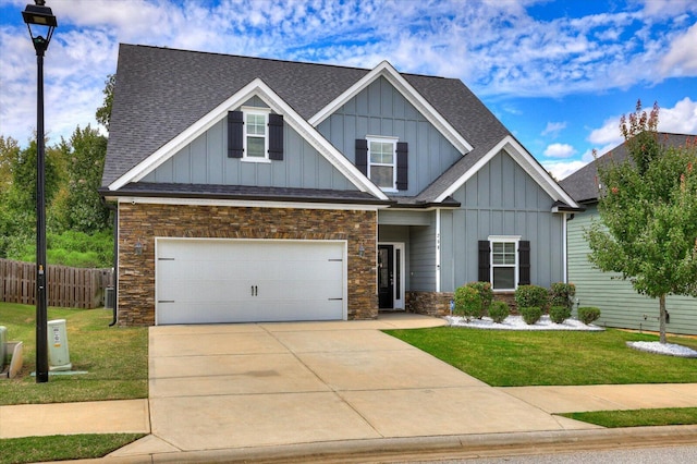 craftsman-style home with a garage and a front yard