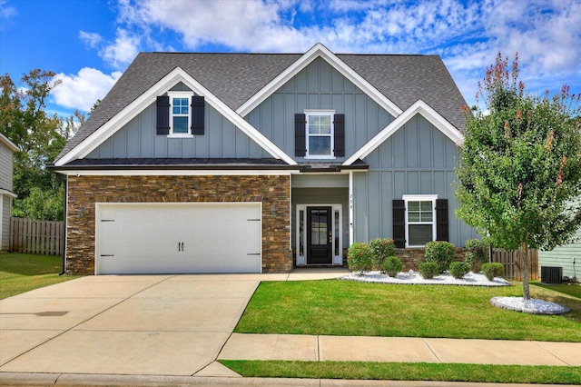 craftsman house with a front lawn, a garage, and central AC