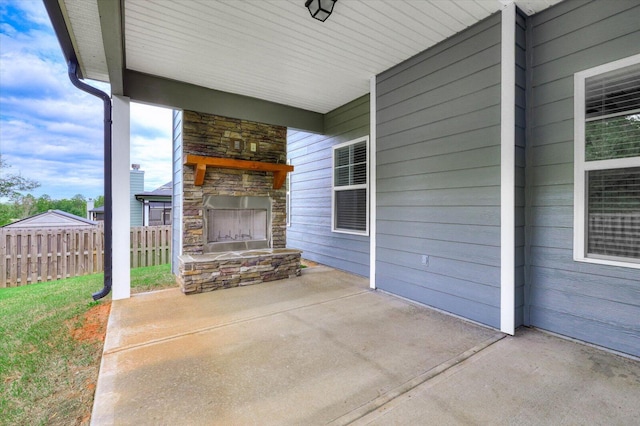 view of patio / terrace featuring an outdoor stone fireplace