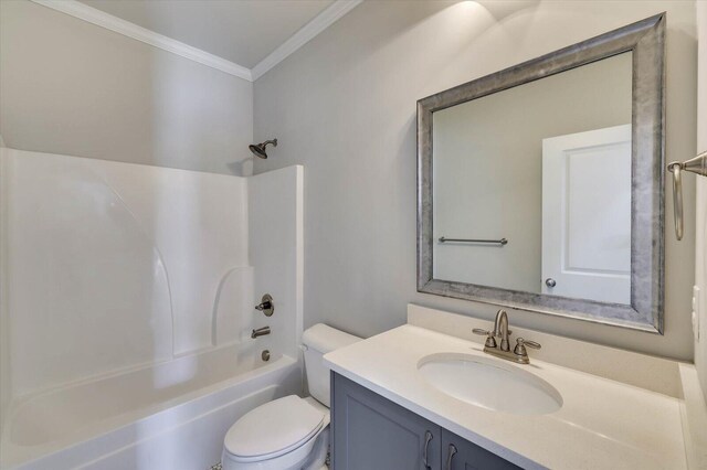 full bathroom featuring crown molding, toilet, vanity, and tub / shower combination