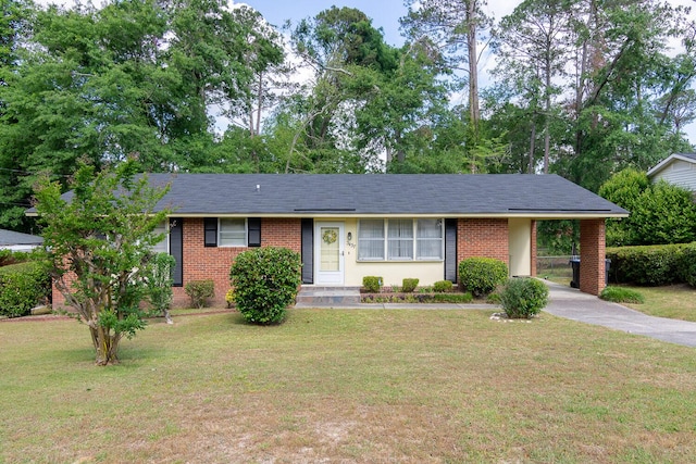 3437 Rushing Rd, Augusta, GA 30906 - single story home with brick siding, an attached carport, a front yard, and concrete driveway