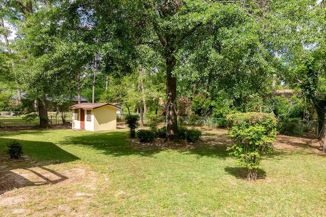 3437 Rushing Rd, Augusta, GA 30906 - view of yard featuring a shed, an outbuilding, and fence