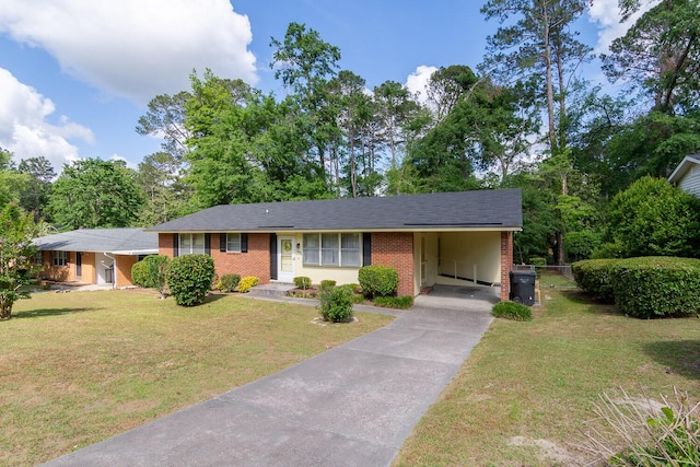 3437 Rushing Rd, Augusta, GA 30906 - ranch-style house featuring brick siding, driveway, a front yard, and an attached carport