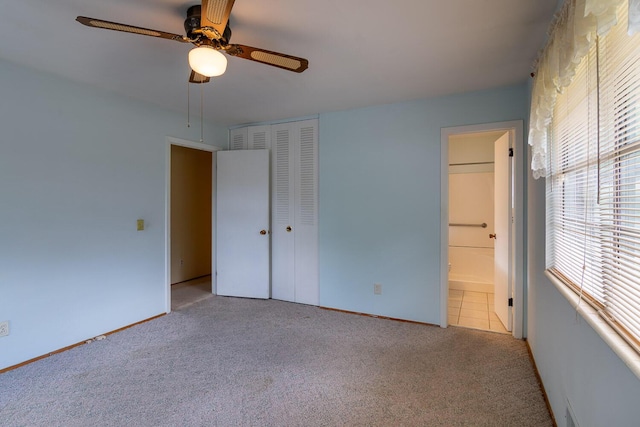 3437 Rushing Rd, Augusta, GA 30906 - unfurnished bedroom featuring a closet, ensuite bathroom, baseboards, ceiling fan, and carpet flooring