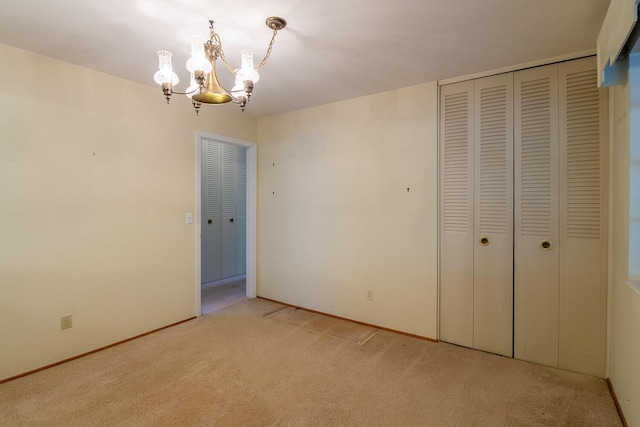 3437 Rushing Rd, Augusta, GA 30906 - unfurnished bedroom featuring light colored carpet, baseboards, a notable chandelier, and a closet