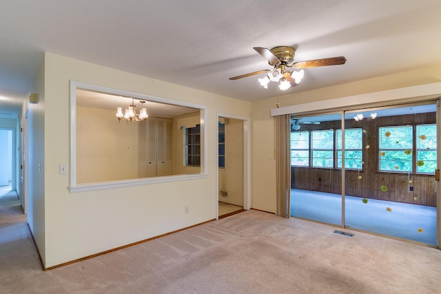 3437 Rushing Rd, Augusta, GA 30906 - unfurnished room featuring carpet floors, baseboards, visible vents, and ceiling fan with notable chandelier
