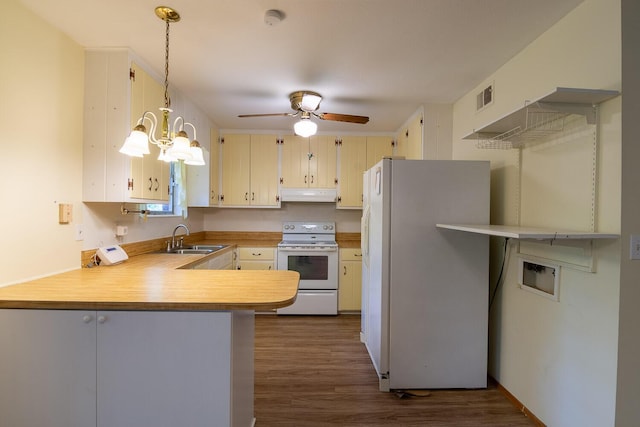 3437 Rushing Rd, Augusta, GA 30906 - kitchen featuring visible vents, white appliances, light countertops, under cabinet range hood, and a sink