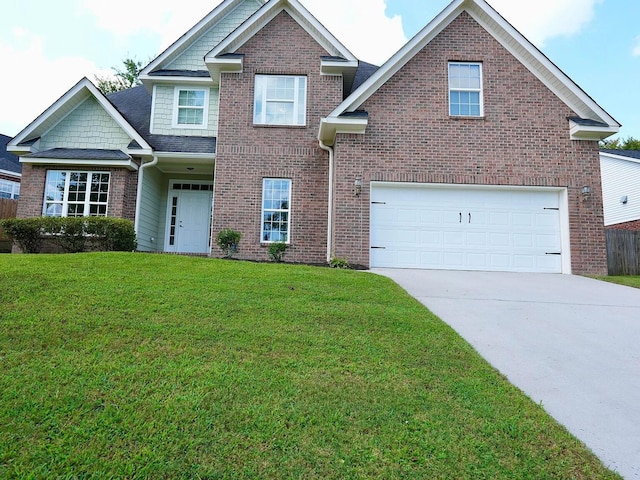 view of front of house featuring a garage and a front yard