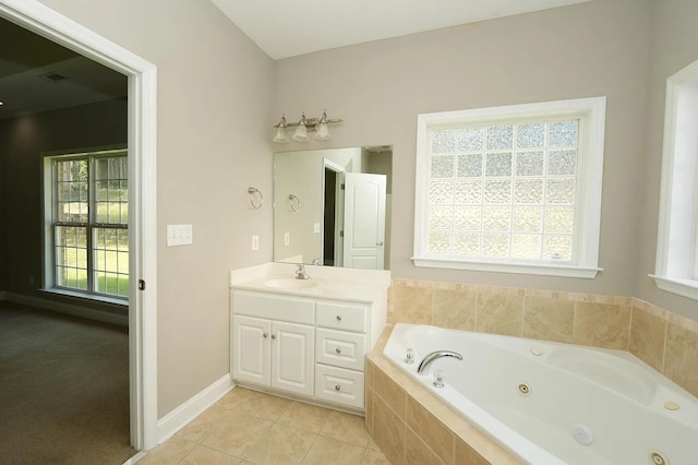 bathroom with vanity, tiled bath, and tile patterned floors