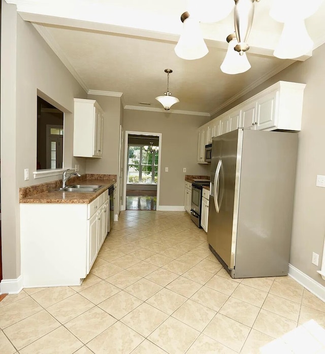 kitchen featuring white cabinetry, ornamental molding, appliances with stainless steel finishes, and sink