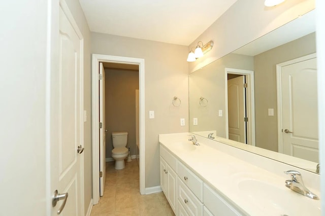 bathroom featuring vanity, toilet, and tile patterned flooring