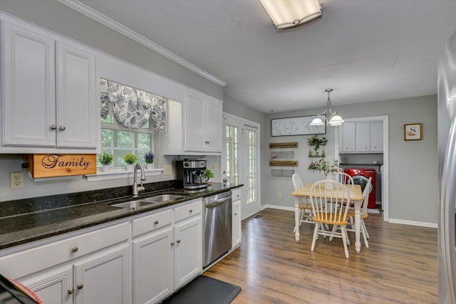 864 Chase Rd, Evans, GA 30809 - kitchen with dishwasher, a sink, white cabinetry, washer and dryer, and baseboards