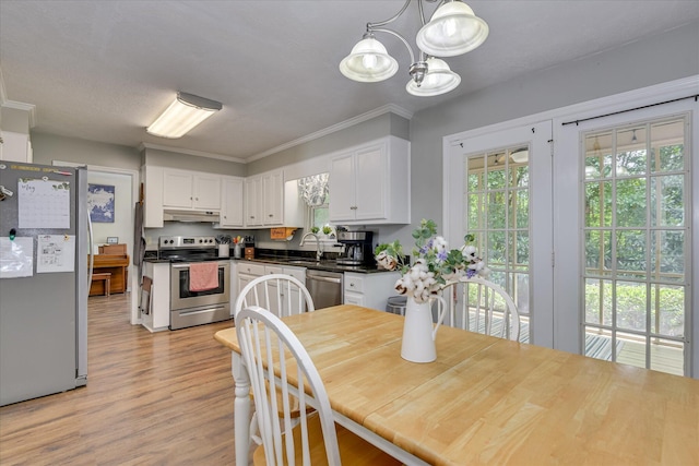 864 Chase Rd, Evans, GA 30809 - dining space with light wood-style floors, a chandelier, and ornamental molding