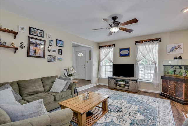 864 Chase Rd, Evans, GA 30809 - living area featuring a ceiling fan, wood finished floors, and baseboards