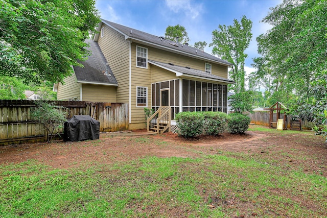 864 Chase Rd, Evans, GA 30809 - rear view of property featuring a sunroom, a playground, a fenced backyard, and a shingled roof