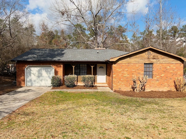 single story home featuring a garage and a front yard