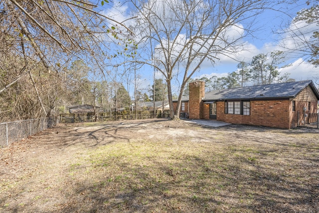 view of yard with a patio and fence