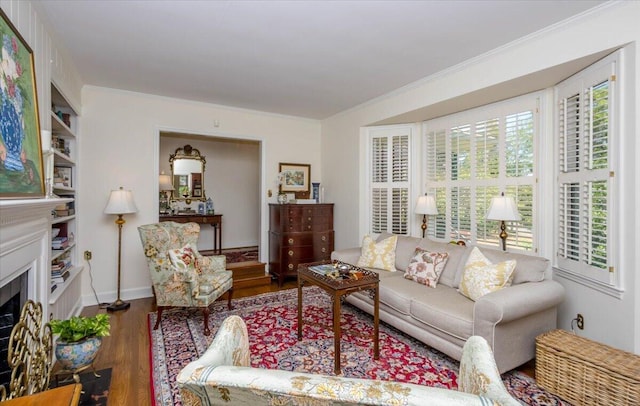 3034 Bransford Rd, Augusta, GA 30909 - living area featuring baseboards, wood finished floors, a fireplace, and ornamental molding