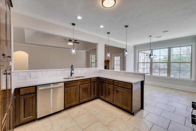 kitchen featuring a sink, visible vents, light countertops, and dishwasher