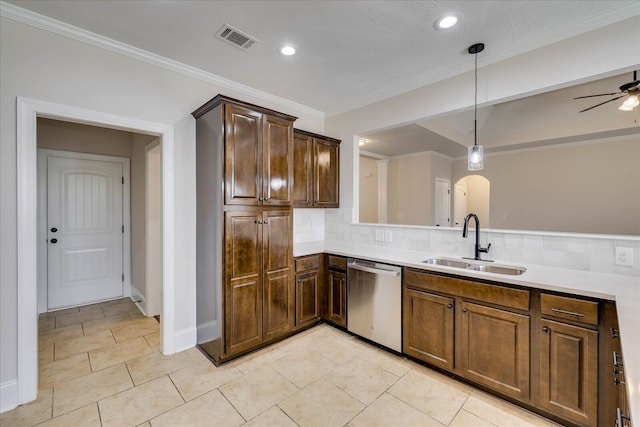 kitchen featuring dishwasher, light countertops, a sink, and visible vents