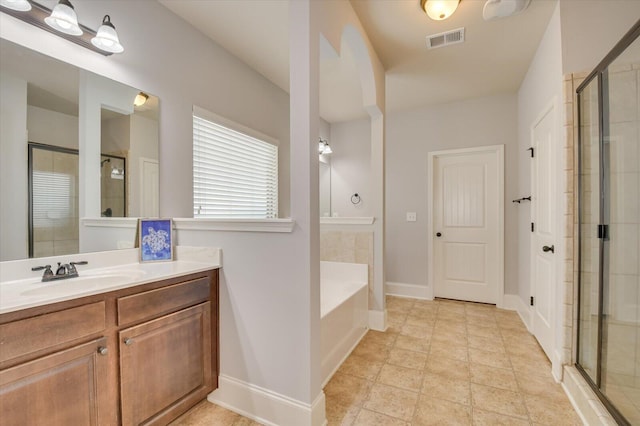 bathroom with separate shower and tub and vanity