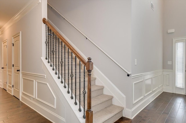 stairway with hardwood / wood-style floors