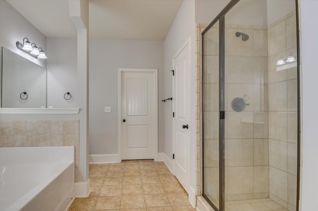 bathroom with separate shower and tub