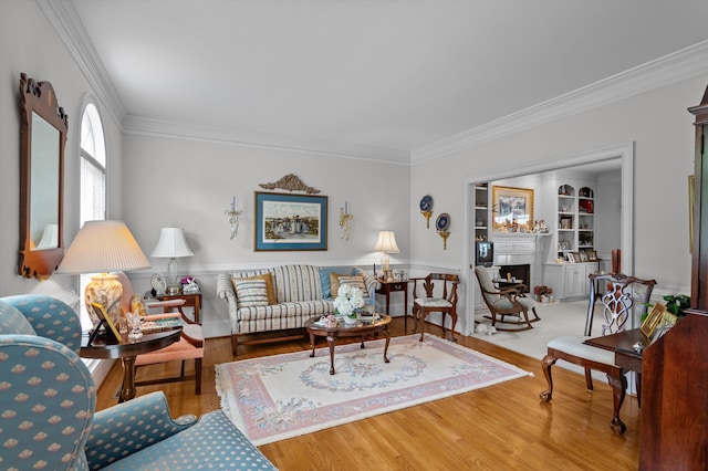 608 Saw Grass Dr, Martinez, GA 30907 - living room with built in shelves, a fireplace, crown molding, and wood finished floors