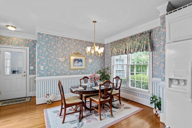 608 Saw Grass Dr, Martinez, GA 30907 - dining space with wainscoting, ornamental molding, a notable chandelier, and light wood-style floors