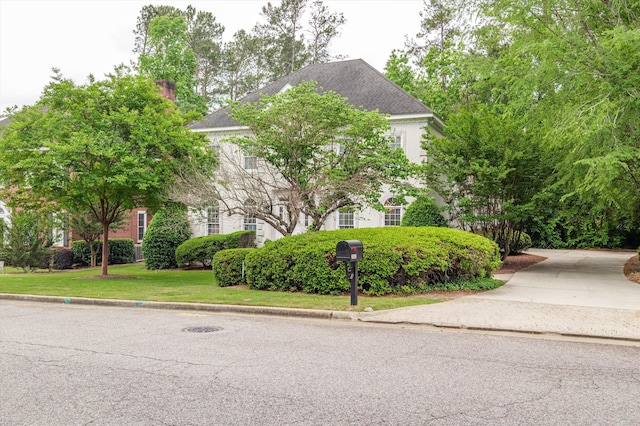 608 Saw Grass Dr, Martinez, GA 30907 - view of front facade featuring a chimney, driveway, and a front lawn