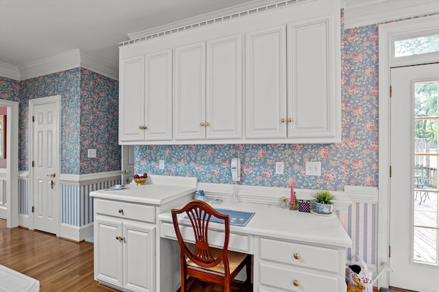 608 Saw Grass Dr, Martinez, GA 30907 - office featuring built in study area, crown molding, wainscoting, wallpapered walls, and light wood-style floors