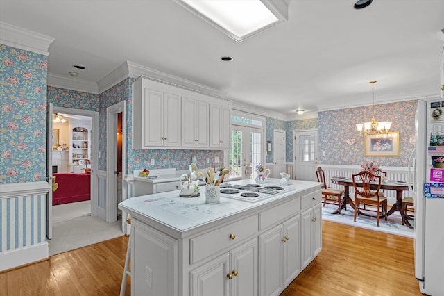 608 Saw Grass Dr, Martinez, GA 30907 - kitchen with white appliances, a wainscoted wall, light wood-type flooring, light countertops, and wallpapered walls