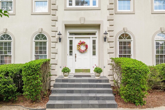 608 Saw Grass Dr, Martinez, GA 30907 - doorway to property with stucco siding