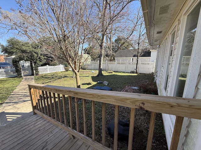 deck featuring a lawn