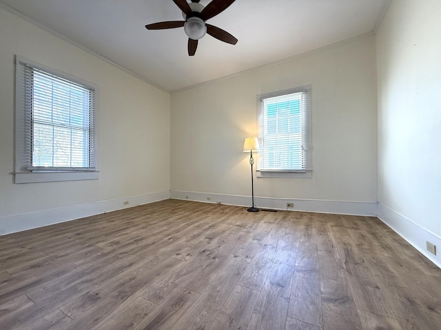 unfurnished room featuring ceiling fan, light hardwood / wood-style floors, and a healthy amount of sunlight