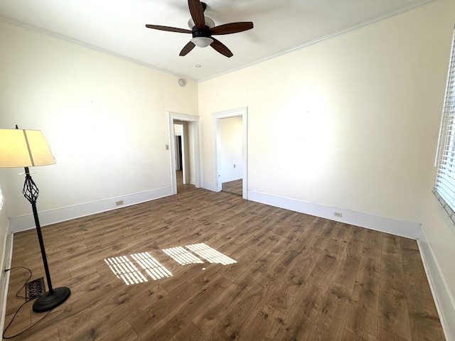 unfurnished bedroom with dark hardwood / wood-style flooring, ornamental molding, and ceiling fan