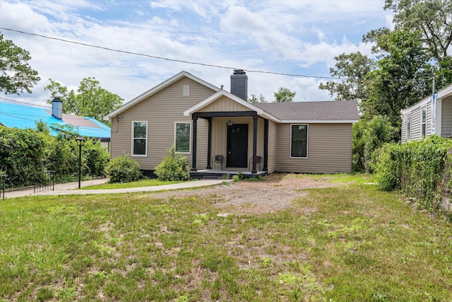 2156 Telfair St, Augusta, GA 30904 - view of front facade featuring a chimney, a front yard, and a porch