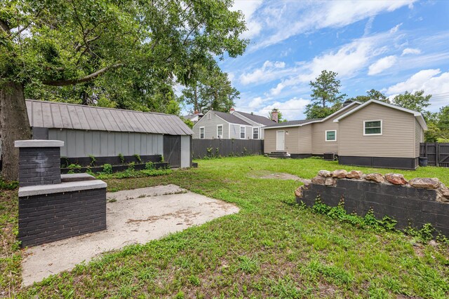2156 Telfair St, Augusta, GA 30904 - view of yard with an outdoor structure, entry steps, and cooling unit