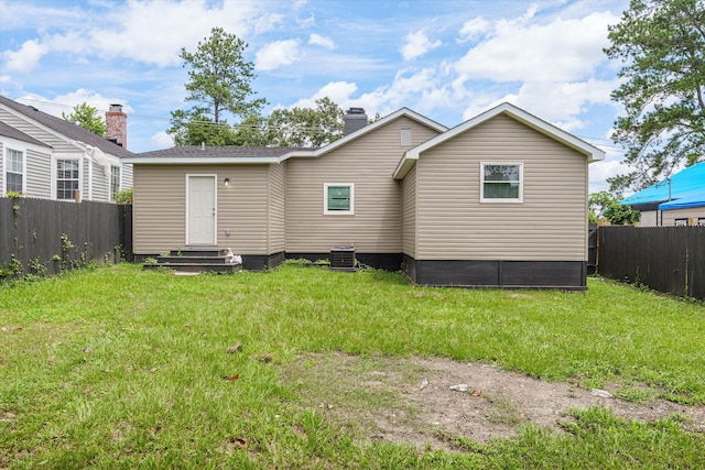 2156 Telfair St, Augusta, GA 30904 - rear view of property with central AC and a chimney